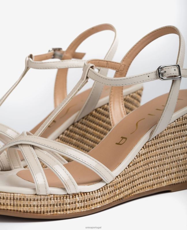 Unisa sandálias de tira em t de couro envernizado mulheres 6V2Z6440 moda